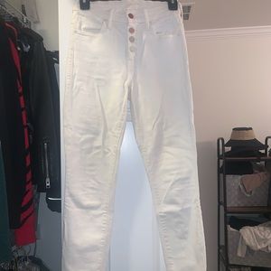 White mother jeans with pink rainbow buttons. (24)